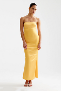 Front view of a model wearing the yellow Studio LEXI Bora Dress
