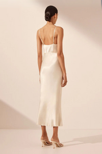 backside profile of a model wearing midi cream dress